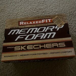 Skechers memory foam slip on loafers.